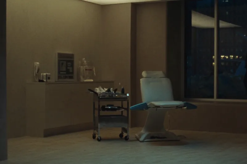 Hair restoration treatment suite with a single reclining chair at dusk
