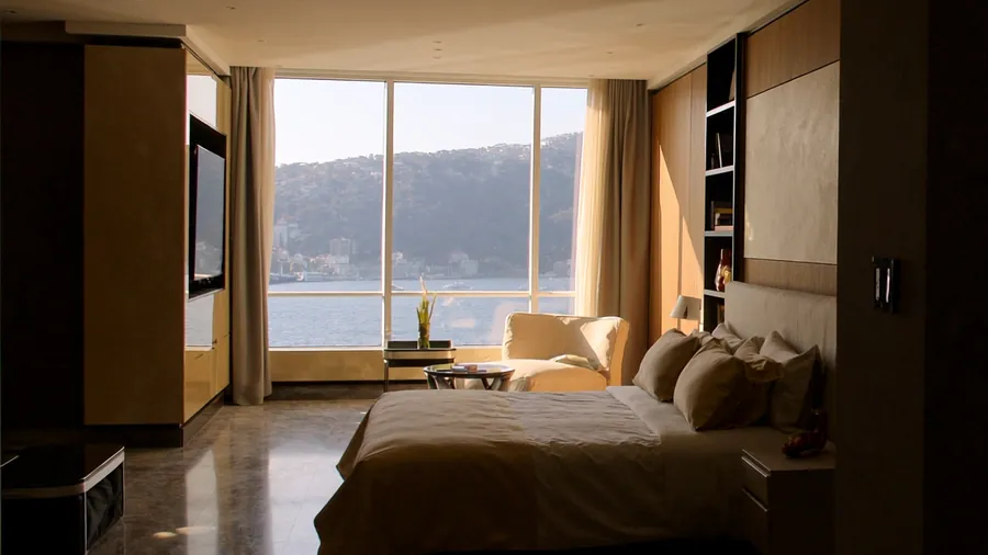 Hotel suite in Istanbul with a window overlooking the Bosphorus in morning light